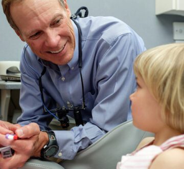 Dr. Bruce Martinson With Kid's Treatment